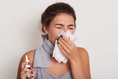 ill-allergic-woman-blowing-running-nose-having-got-flu-catch-cold-sneezing-handkerchief-posing-with-closed-eyes-isolated-white-holding-nasal-spray-hand-scaled.jpg
