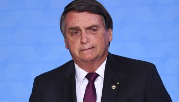 Brazilian President Jair Bolsonaro gestures during the ceremony celebrating 100 million digital savings accounts in the state bank Caixa Economica at Planalto Palace in Brasilia, on November 4, 2020. (Photo by EVARISTO SA / AFP)