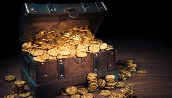 Open treasure chest filled with gold coins / HIgh contrast image